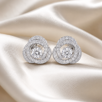 Silver-toned circular earrings with layered stone-set detailing and bright centre