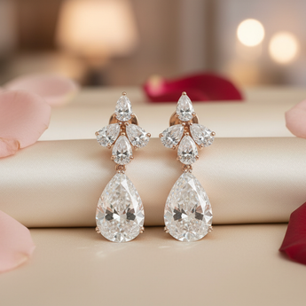 Pair of rose gold pear diamond cluster earrings - lifestyle