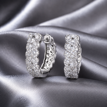 Silver-toned hoop earrings with intricate stone-set detailing