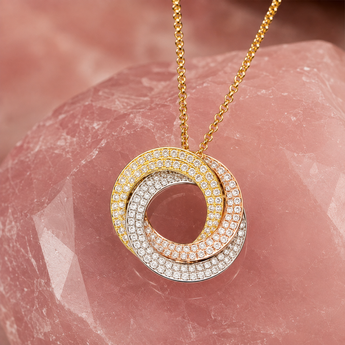 Three-tone gold-plated silver circular pendant with stone-set finish and chain