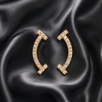 Pavé curved bar stud earrings on black satin