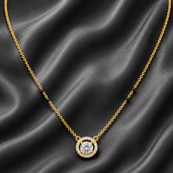 Gold-plated halo solitaire mangalsutra with black beads on dark grey satin