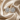 ATJ - 118 silver pear-cut floral stud earrings on cream satin