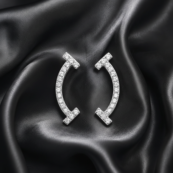 ATJ - 106 silver pavé curved bar stud earrings on black satin